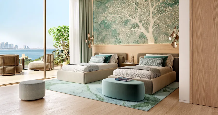 Bedroom with a tree-patterned feature wall and a terrace view of the sea