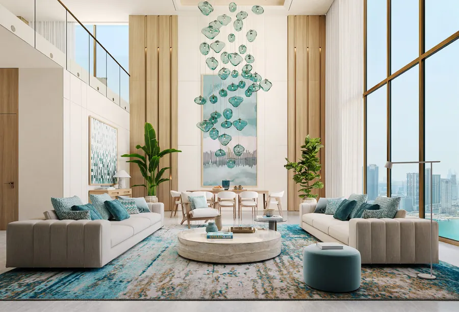 Double-height living room in sand and sea-glass tones with a floor-to-ceiling window