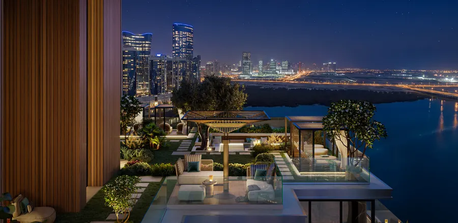 Sky terrace lounge with the Abu Dhabi skyline lit up at night