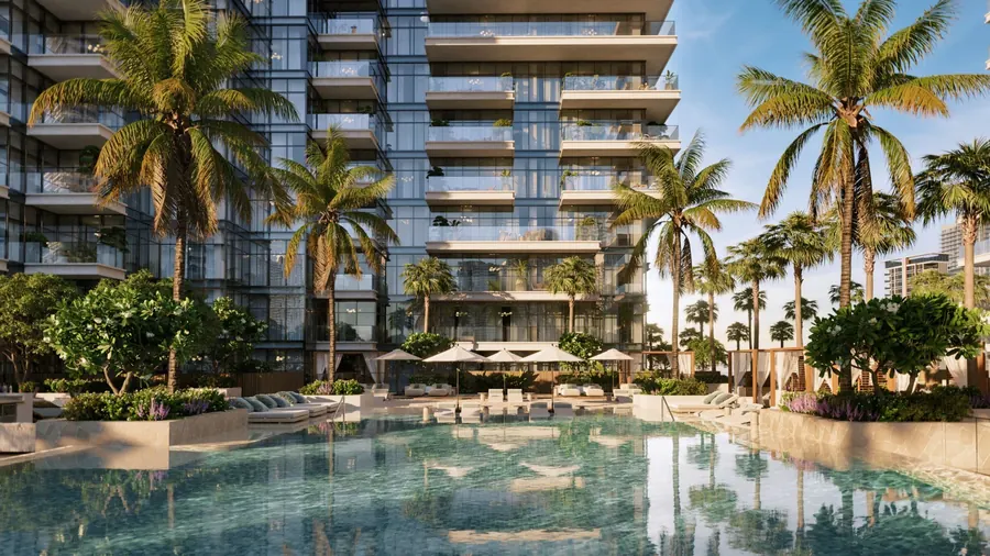 Palm-lined resort pool at the foot of the towers