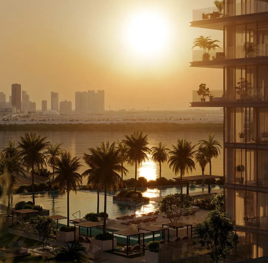 Sun setting over the water, seen past planted terraces